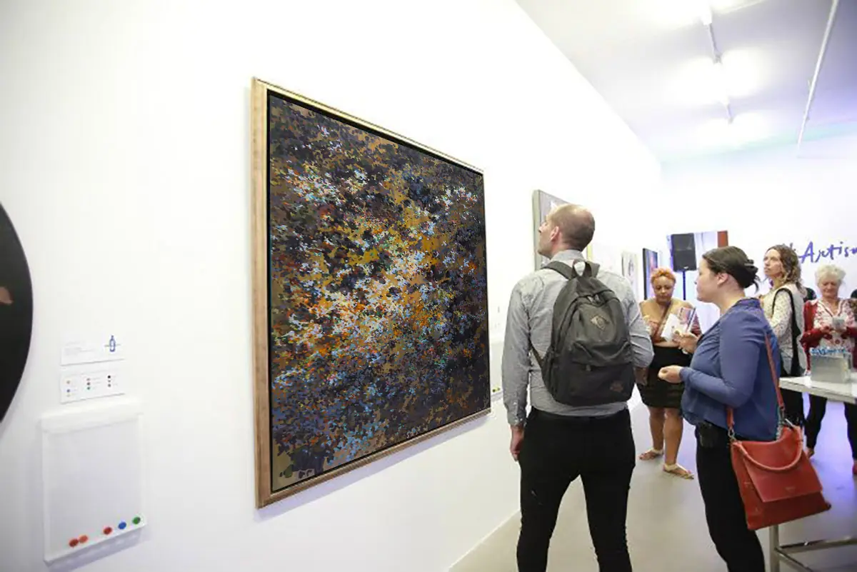 Visitors viewing a large abstract painting at the exhibition