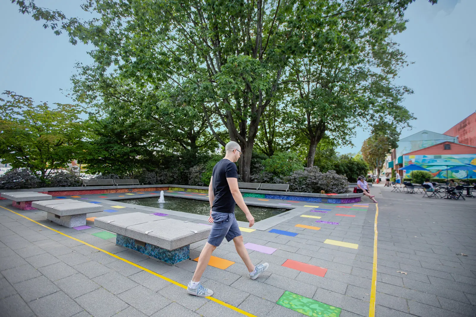 Artist walking through the marked plaza as the public work takes shape